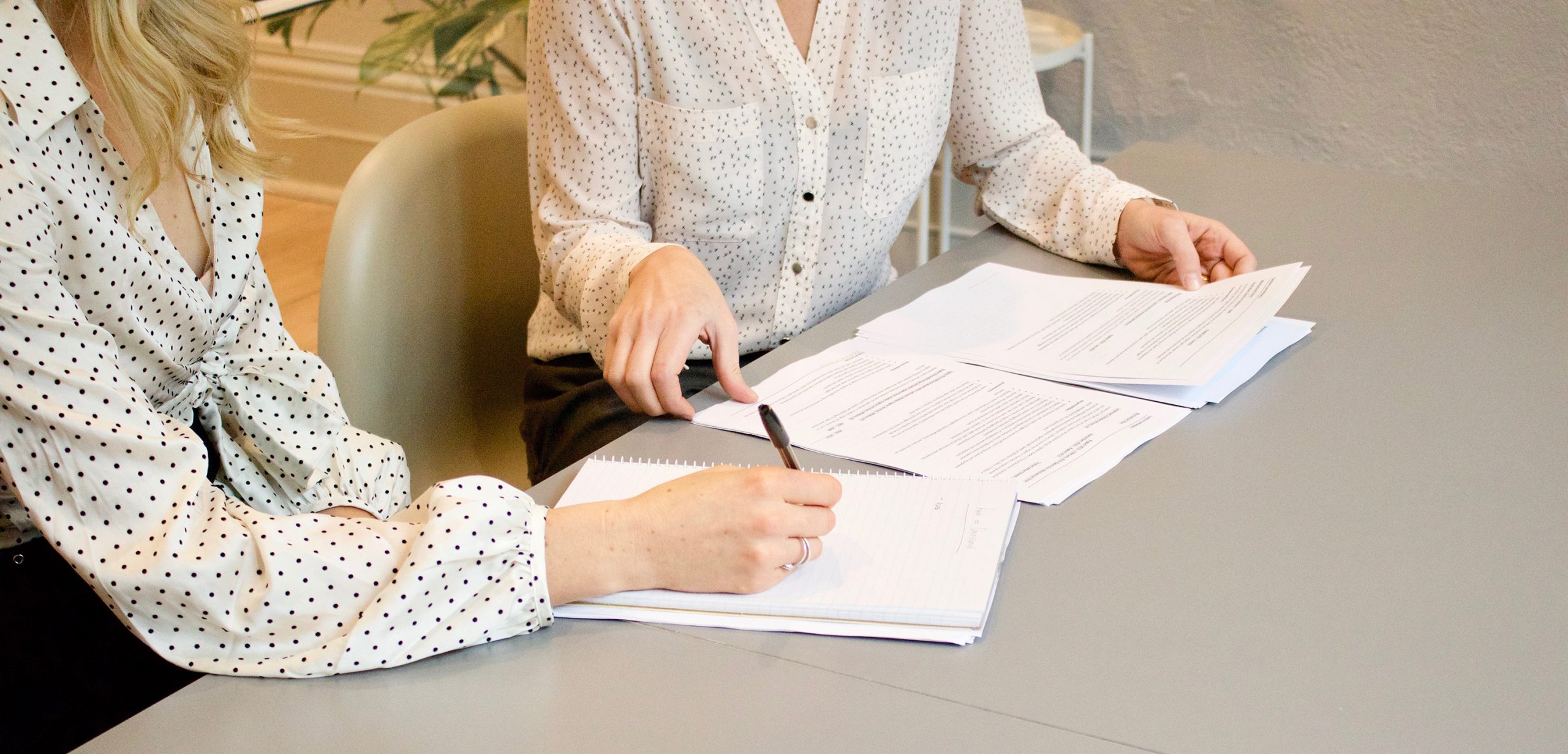 Lady signing a document